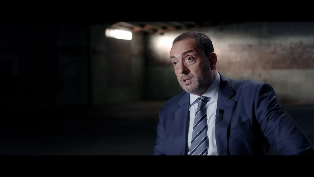 Detective Joe Kirby giving an interview about the investigation in the horror mockumentary Strange Harvest